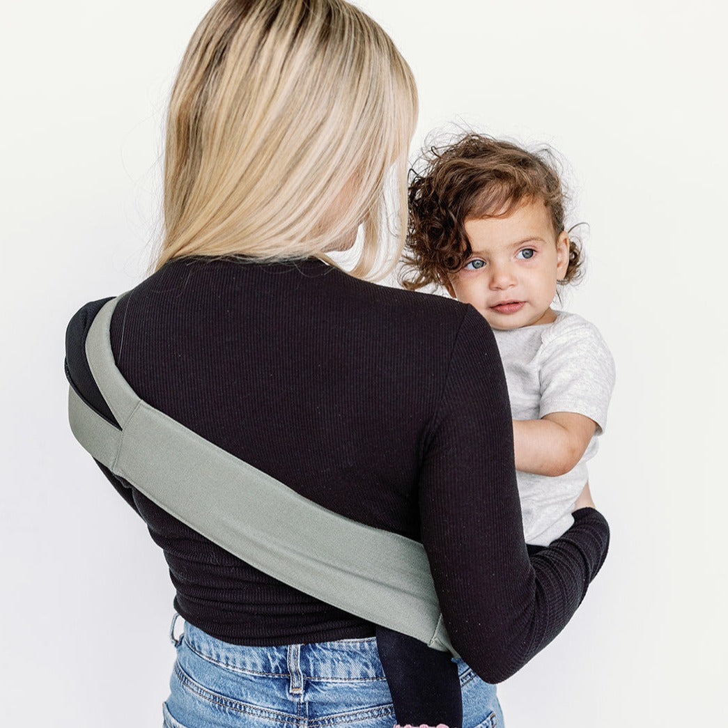 Close-up of the Olive Rouu Baby II hip carrier fabric and seat