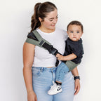 Parent and child outdoors with the Olive Rouu Baby II hip carrier